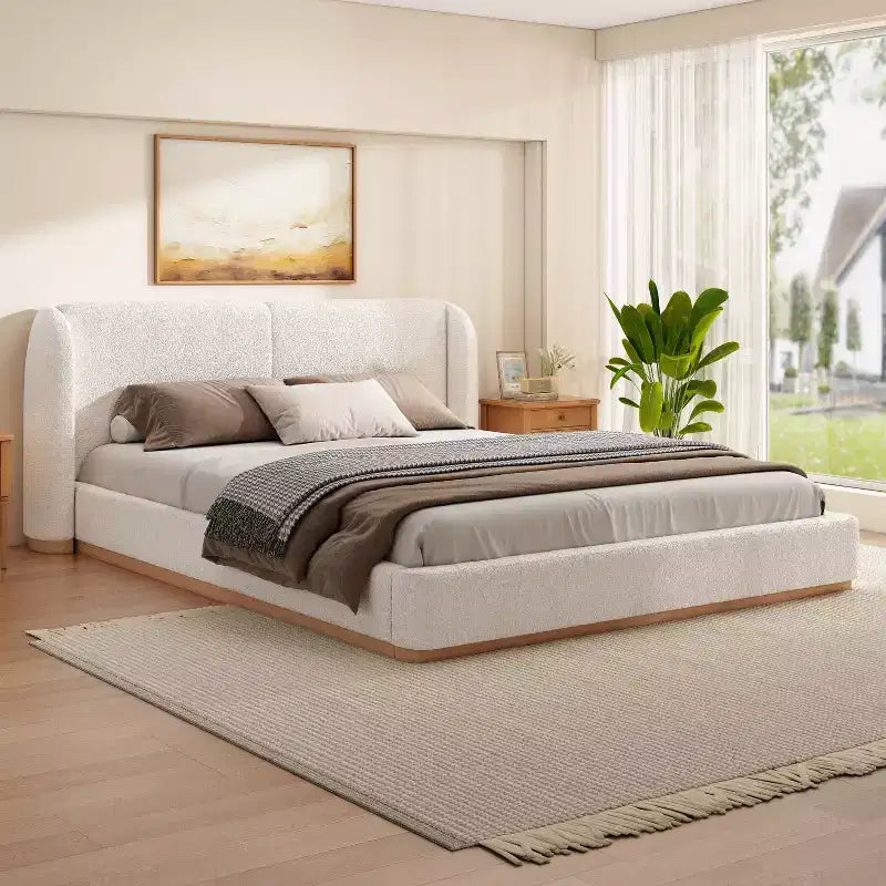 Letto moderno imbottito in bouclé in legno di gomma con testiera ad ali